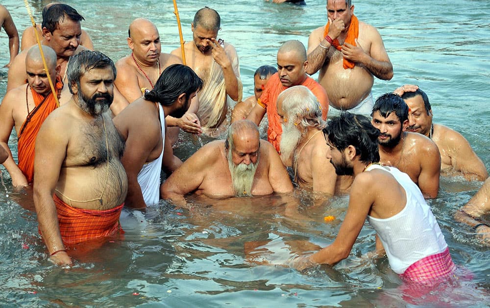 Shankaracharya Swami Swaroopanand Saraswati Maharaj takes dip during Kumbh mela.