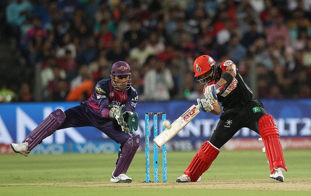 Royal Challengers Bangalore captain Virat Kohli plays a shot against Rising Pune Supergiants during their IPL match at the Maharashtra Cricket Associations International Stadium.