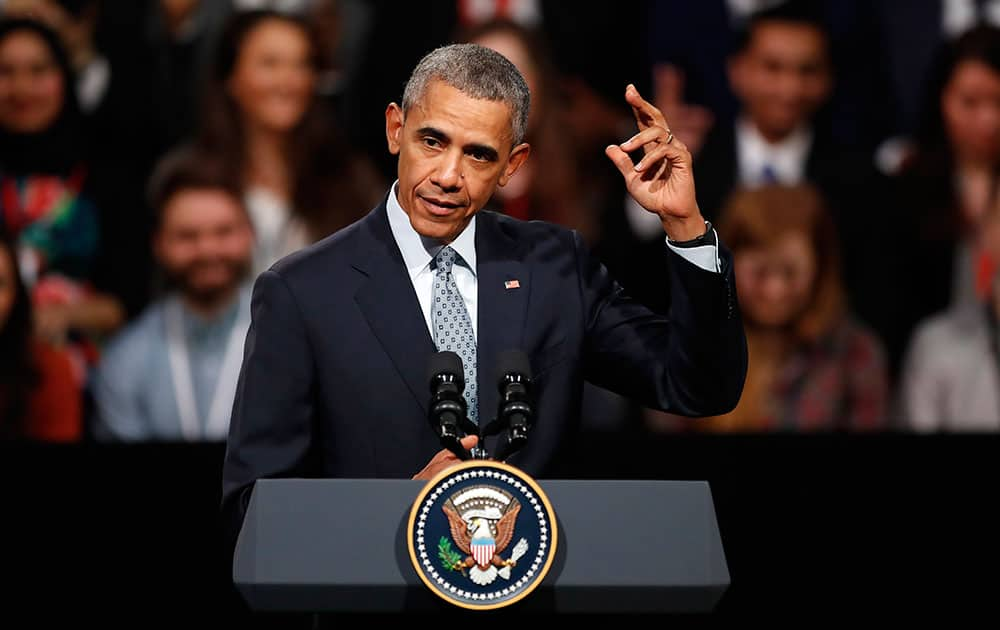 US President Barack Obama gestures as he speaks to a town hall meeting with an audience from the US Embassy’s Young Leaders UK program at Lindley Hall, the Royal Horticultural Society, in London.