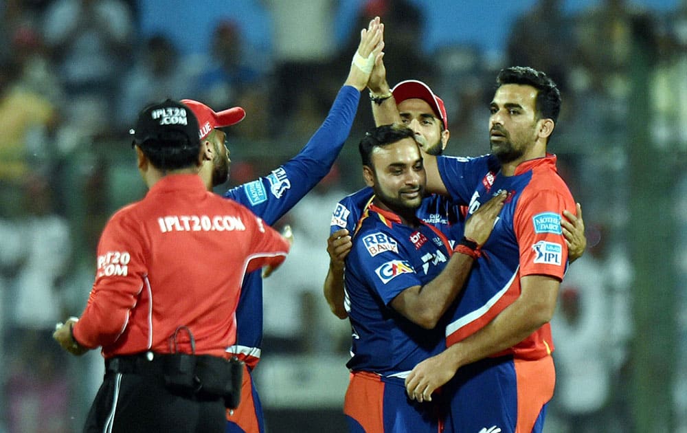 Delhi Daredevils Zaheer Khan celebrates a wicket with team mates during their IPL T20 match against Mumbai Indians in New Delhi.