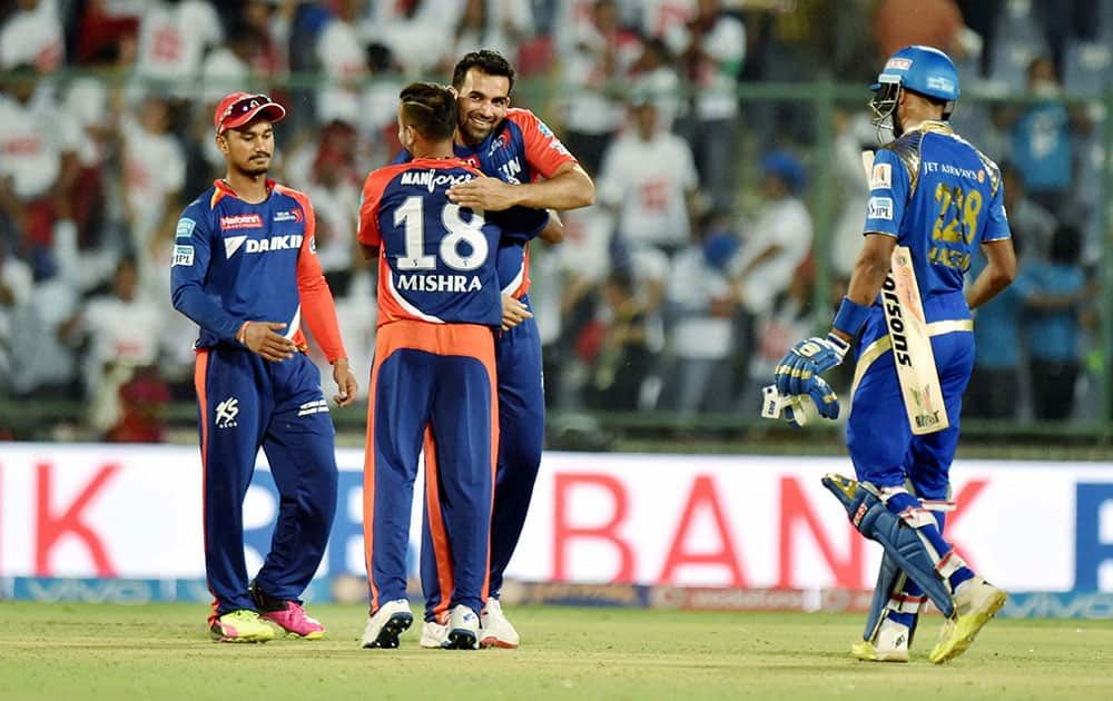 Delhi Daredevils Zaheer Khan celebrates with a team mate after their win over Mumbai Indians in the IPL T20 match in New Delhi.