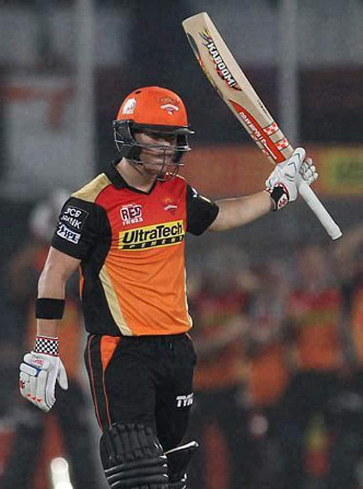 Sunrisers Hyderabad captain David Warner celebrates his fifty during an IPL T-20 matcha against Kings XI Punjab in Hyderabad.