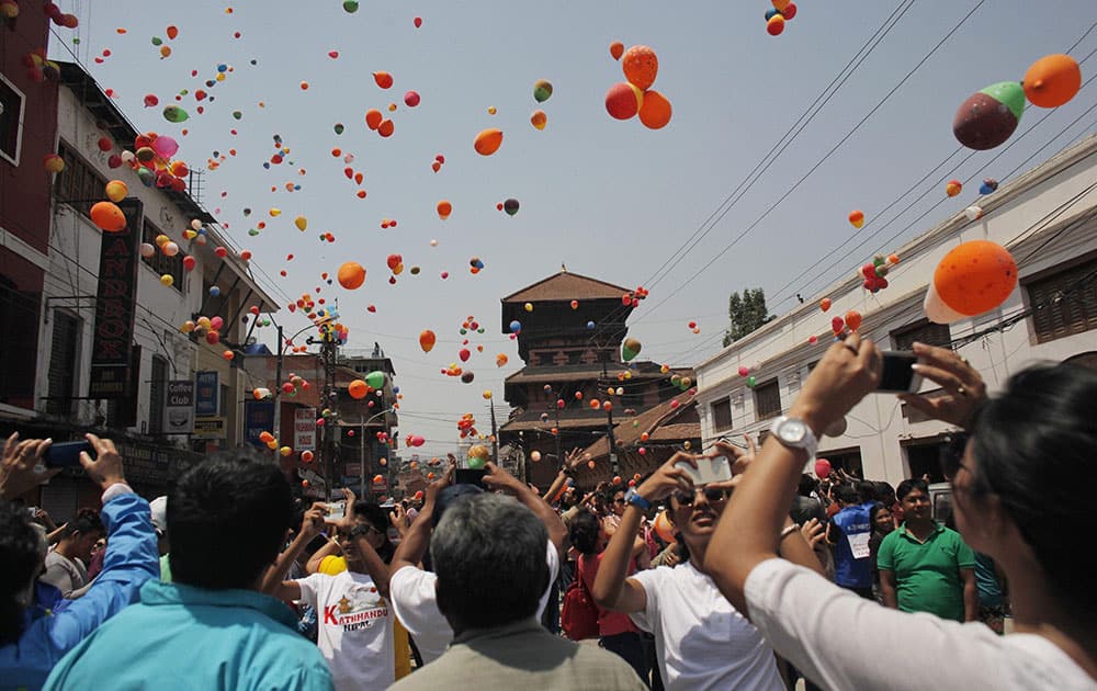 Nepalese people release balloons in memory of those who died in last year’s devastating earthquake in Kathmandu, Nepal.