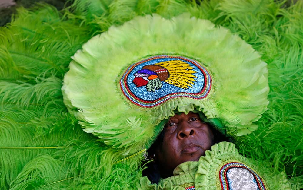 A member of the Mowhawk Hunters Mardi Gras Indians performs at the New Orleans Jazz and Heritage Festival in New Orleans.