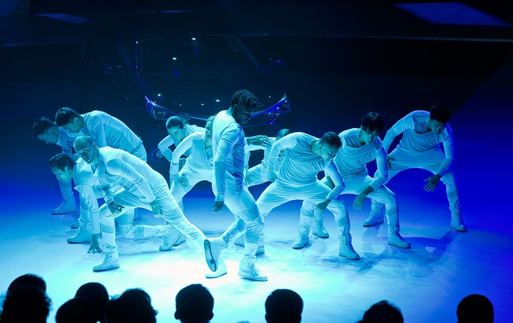 Performers take part in a presentation during the Toyota Motor Corp. press conference ahead of the Auto China 2016 automobile exhibition in Beijing, China.