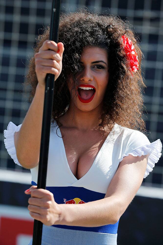 A grid girl poses for the camera during Spain's Motorcycle Grand Prix at the Jerez race track in Jerez de la Frontera, southern Spain.