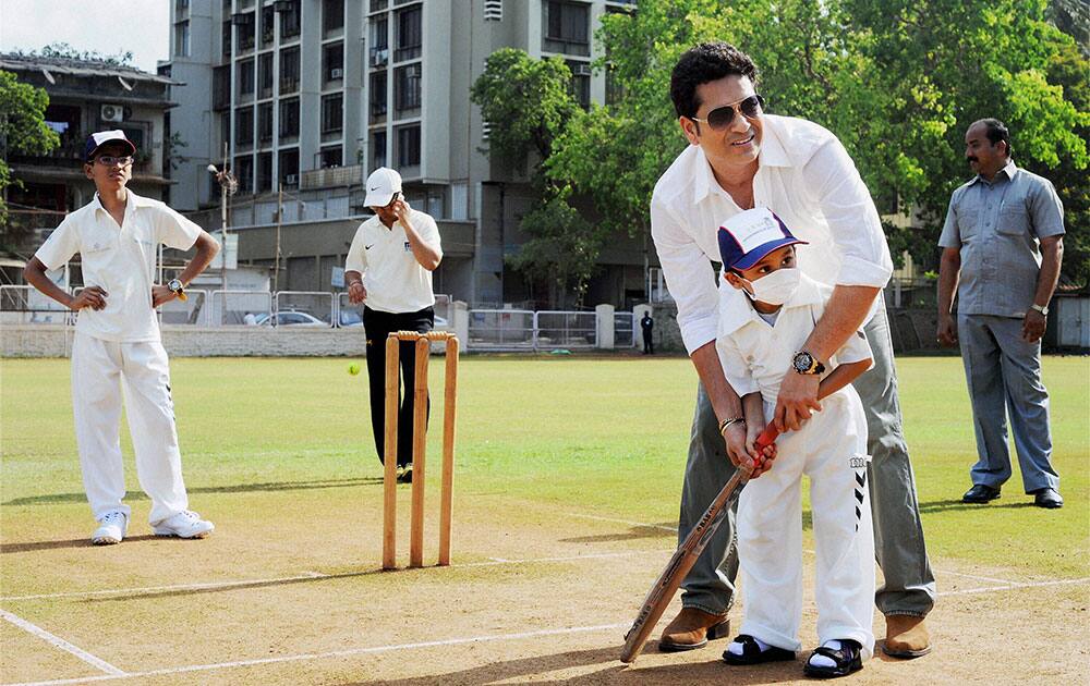 Cricket legend Sachin Tendulkar celebrates his 43rd birthday by playing cricket with children from the Make-A-Wish India organisation in the city in Mumbai.