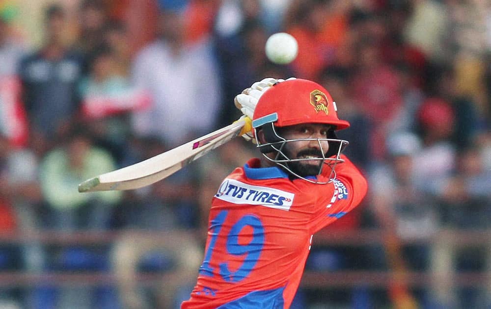 Gujarat Lions Player Dinesh Karthik plays a shot during IPL 2016 match against Royal Challengers Bangalore in Rajkot.