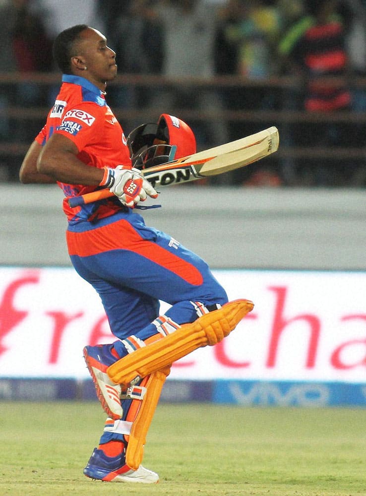 Gujarat Lions Player Dwayne Bravo celebrate after winning match against Royal Challengers Bangalore in Rajkot.