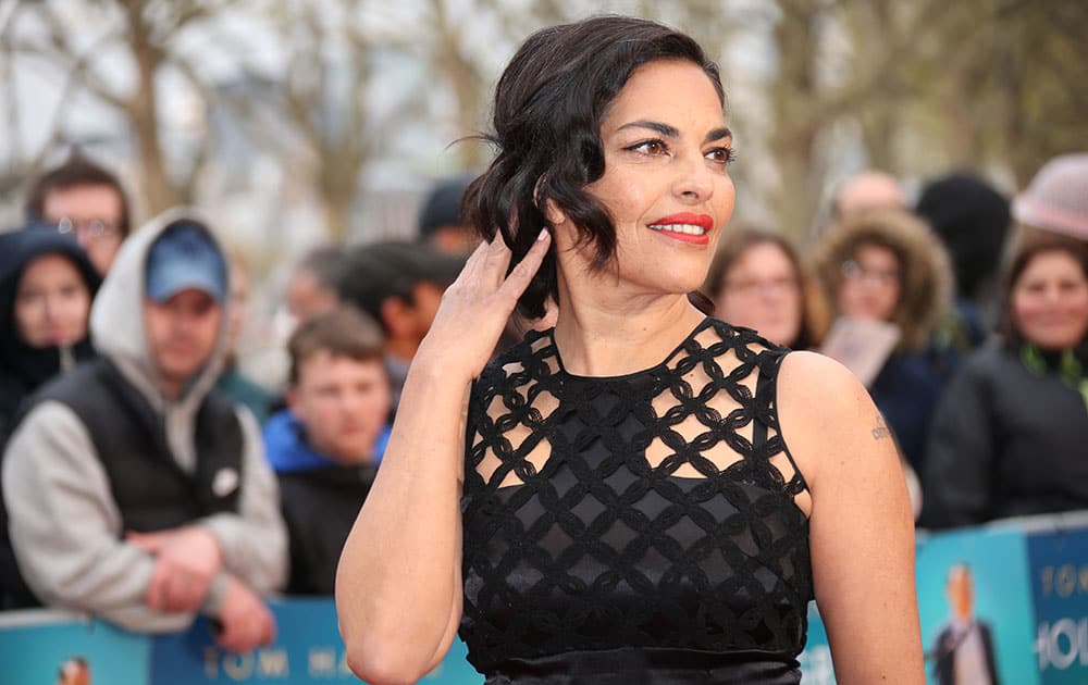 Actress Sarita Choudhury poses for photographers upon arrival at the premiere of the film 'A Hologram For The King' in London.