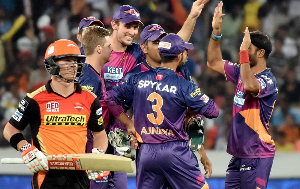 Rising Pune Supergiants players celebrates the dismissal of DA Warner of Sunrisers Hyderabad during an IPL T-20 match in Hyderabad.