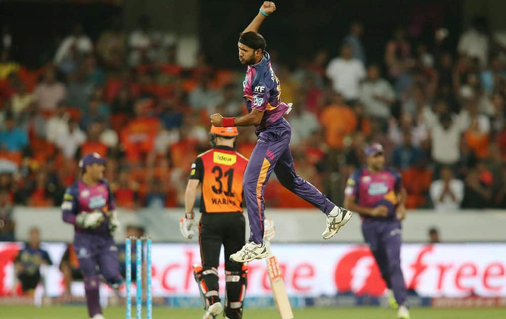 Ashok Dinda of Rising Pune Supergiants celebrates getting Sunrisers Hyderabad captain David Warner wicket during an IPL T-20 match in Hyderabad.