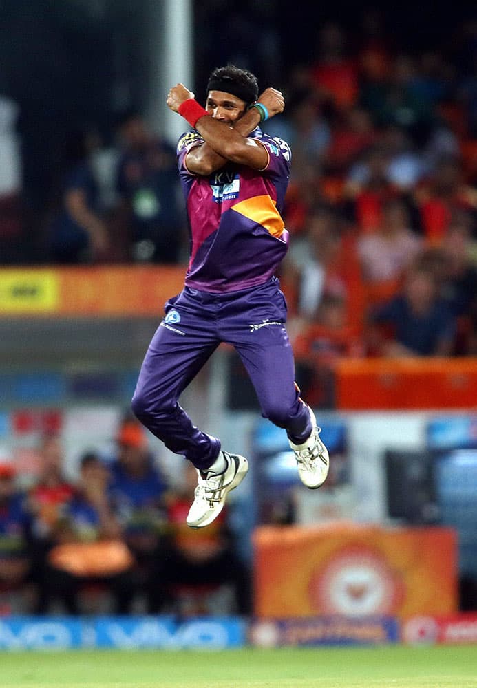 Ashok Dinda of Rising Pune Supergiants celebrates getting Sunrisers Hyderabad captain David Warner wicket during an IPL T-20 match in Hyderabad.