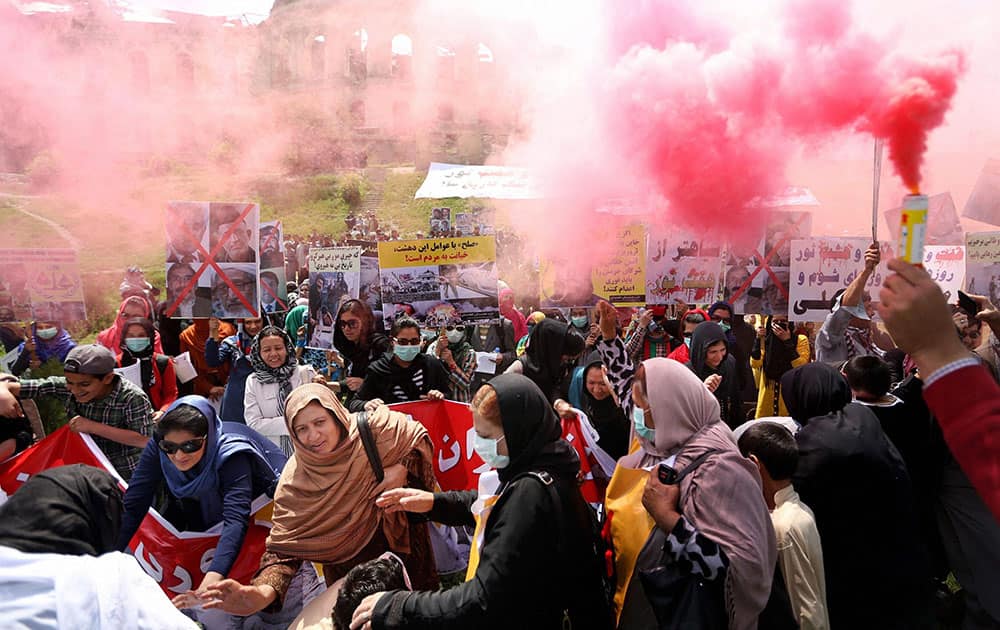 Afghan protesters chant slogans against Afghan politicians during a demonstration in Kabul, Afghanistan.