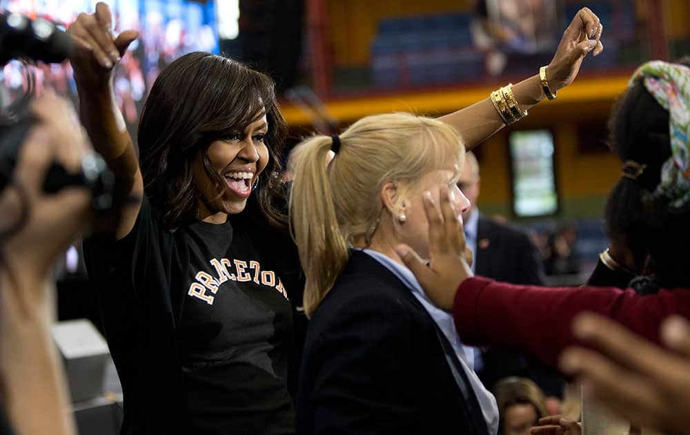 First lady Michelle Obama greets members of the audience while hosting the 2016 College Signing Day in New York. 