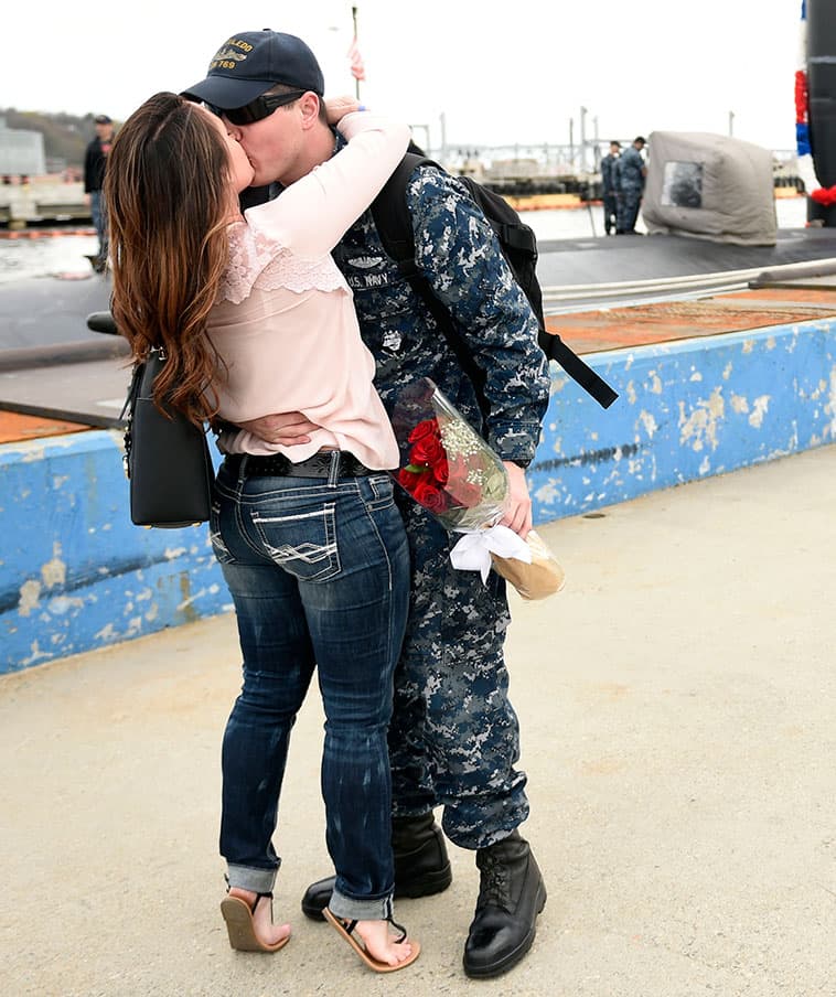 Seaman Jordan Orr is greeted by his wife Kristie Orr as the U.S. Navy submarine USS Toledo (SSN 769) returns to the Navy Submarine Base in Groton, Conn.