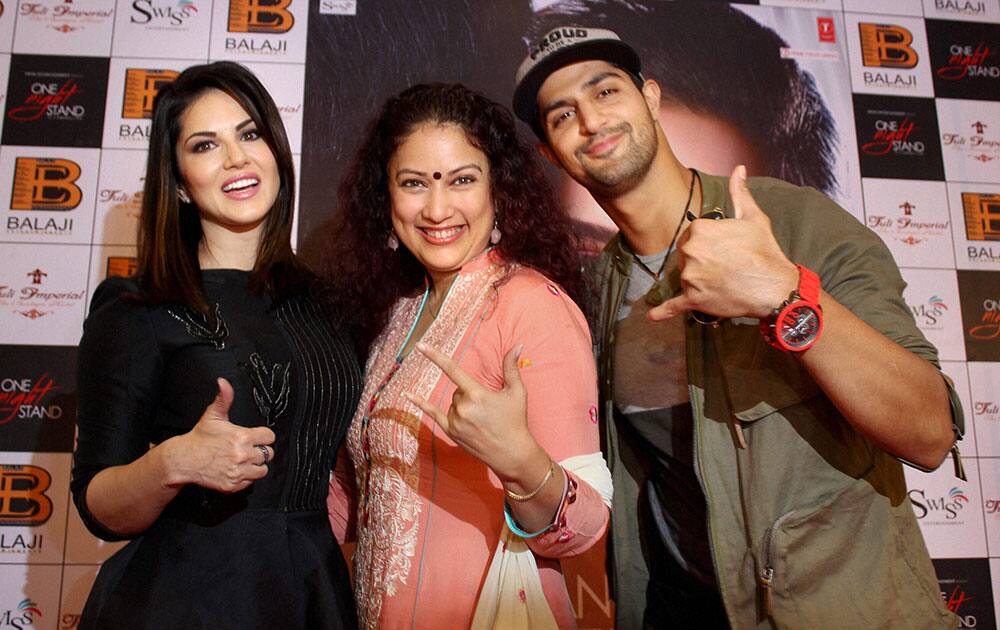 Actors Sunny Leone, Tanuj Virwani and director Jasmin Moses Dsouza pose for photographs after addressing a press conference for their upcoming film One Night Stand in Nagpur.