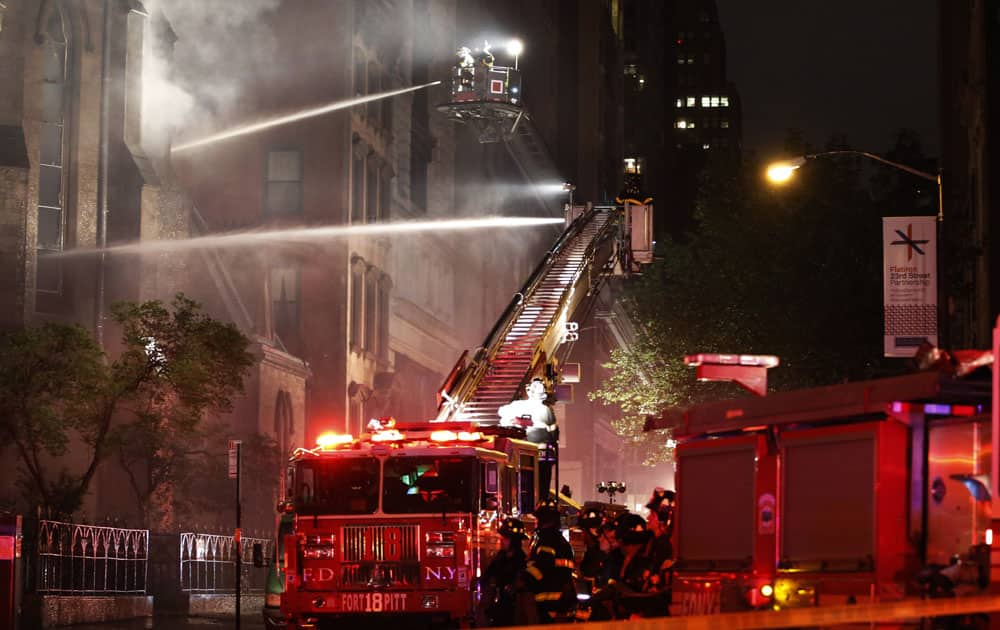 Firefighters battle a three-alarm fire in the historic Serbian Orthodox Cathedral of St. Sava in New York. 