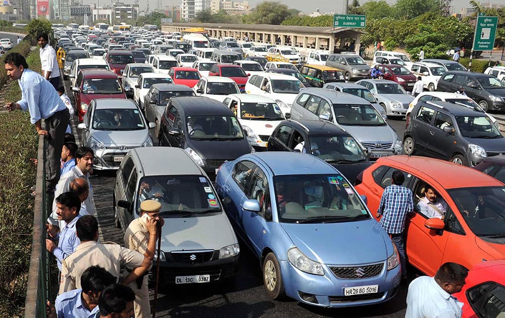 Heavy traffic jam during protest of diesel taxi drivers and owners who jammed the Delhi- Gurgaon expressway at border near Rajokri flyover in protest the ban of diesel taxi in National Capital.