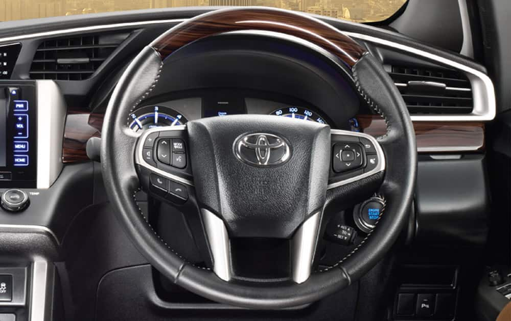 Leather wrapped Steering Wheel with wood finish.