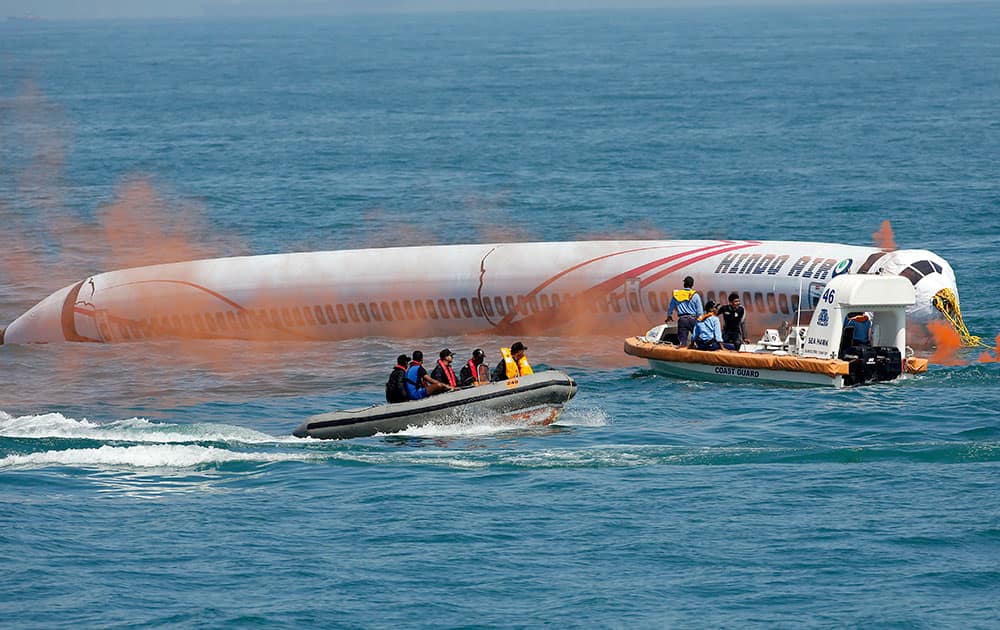 Members of India's National Maritime Search and Rescue (NMSAR) participate in the national maritime search and rescue exercise at the Arabian Sea in Mumbai.