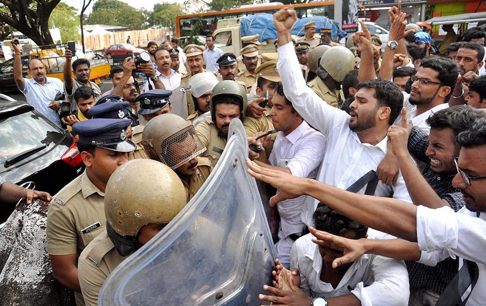 Police stop students who were holding a protest march demanading justice in the rape and murder case of a law student, in Kochi, Kerala.
