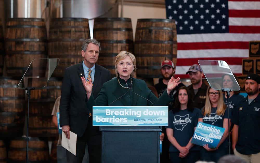 Democratic presidential candidate Hillary Clinton, accompanied by Sen. Sherrod Brown, D-Ohio, speaks during a campaign stop at Jackie O's Production Brewery and Tap Room in Athens, Ohio.