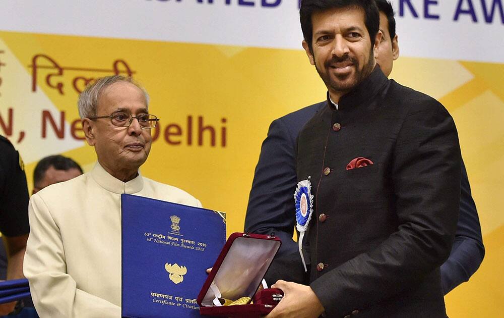 President Pranab Mukherjee presents Best Popular Film award to Director Kabir Khan for his film Bajrangi Bhaijaan at the 63rd National Film Awards 2015 function in New Delhi.