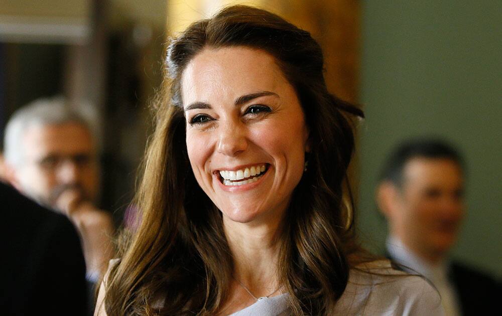 Britain's Kate, The Duchess of Cambridge laughs as she speaks with guests during a reception at Spencer House in London. The Duchess of Cambridge undertook her first engagement as Patron of the Anna Freud Centre by attending a lunch reception supporting the development of a new centre of excellence for children's mental health.