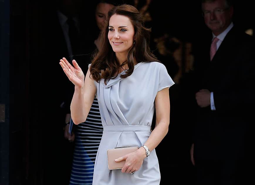 Britain's Kate, The Duchess of Cambridge waves as she leaves after attending a reception at Spencer House in London.