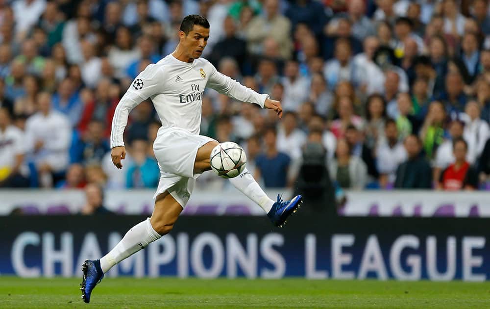 Real Madrid's Cristiano Ronaldo controls the ball during the Champions League semifinal second leg soccer match between Real Madrid and Manchester City at the Santiago Bernabeu stadium in Madrid.