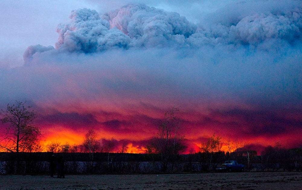 A wildfire moves towards the town of Anzac from Fort McMurray,Alberta. Alberta declared a state of emergency as crews frantically held back wind-whipped wildfires.