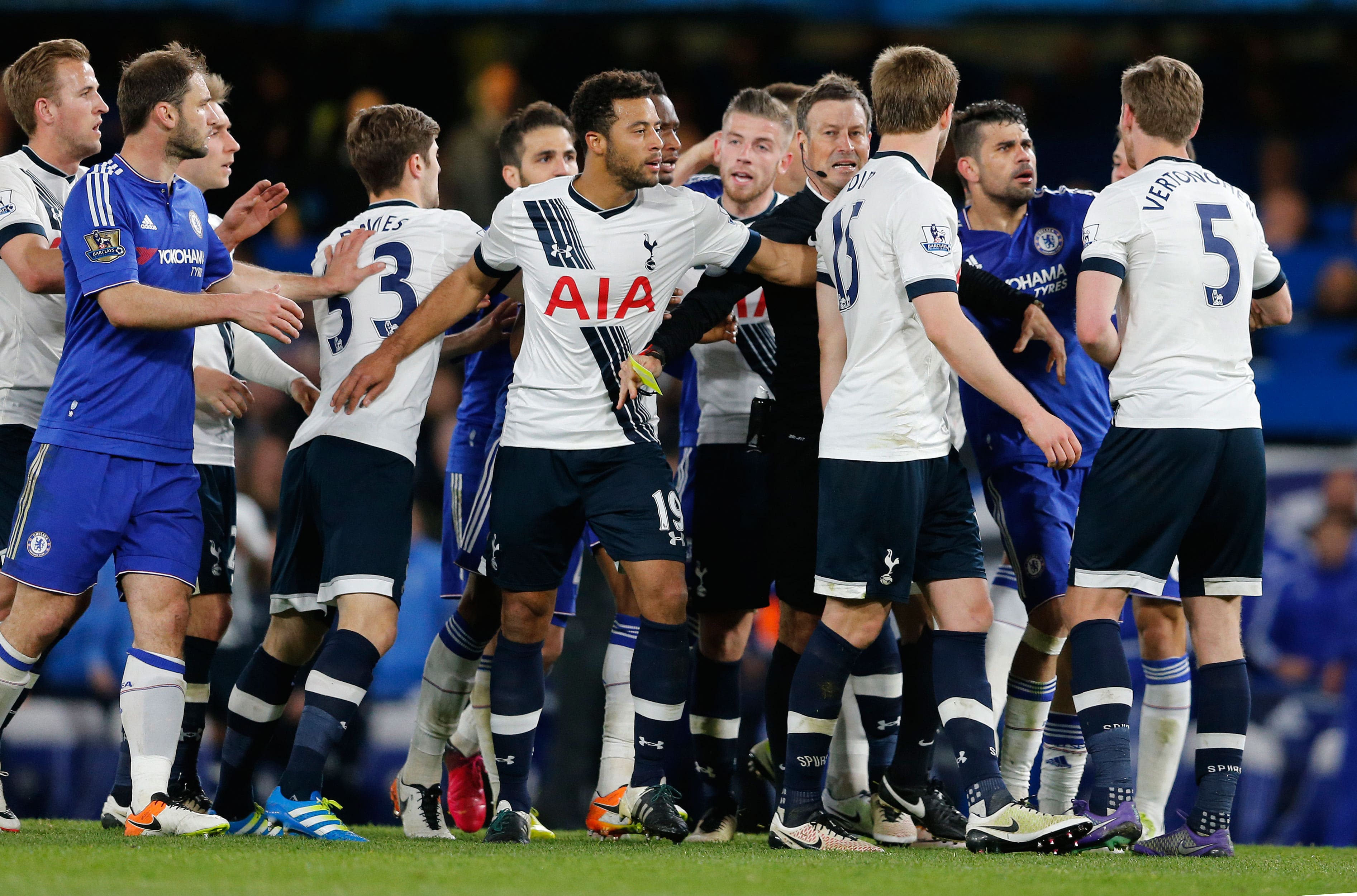 Referee Mark Clattenburg talks with Chelsea and Tottenham players during the English Premier League soccer match between Chelsea and Tottenham Hotspur at Stamford Bridge stadium.