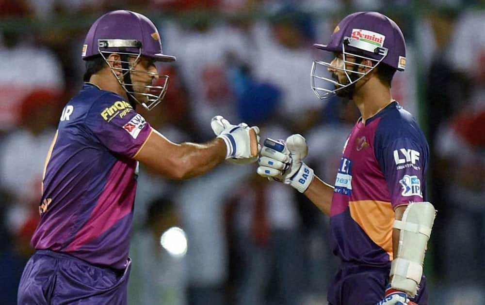 Rising Pune Supergiants players M S Dhoni with A Rehane during an IPL T20 match against Delhi Daredevils in New Delhi.