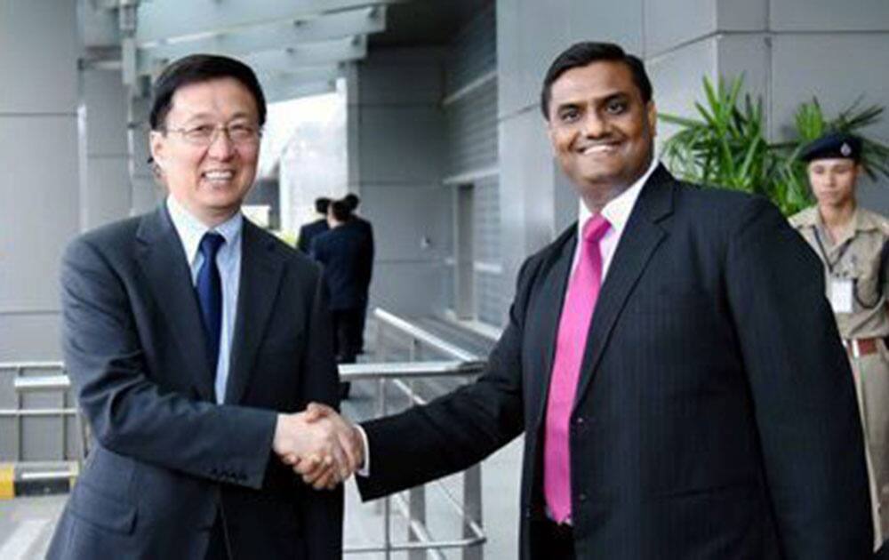 Han Zheng, CPC Party Secretary of Shanghai shakes hands with Consul-General of India in Shanghai, Prakash Gupta, on his arrival in New Delhi.