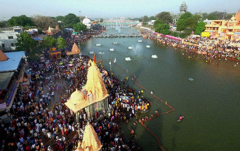 Devotees take holy dip in River Kshipra during Simhastha Maha Kumbh Mela in Ujjain.
