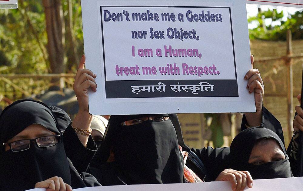 Women activists shout slogans and hold placards during a protest demanding shut down of the dance bars in Mumbai.