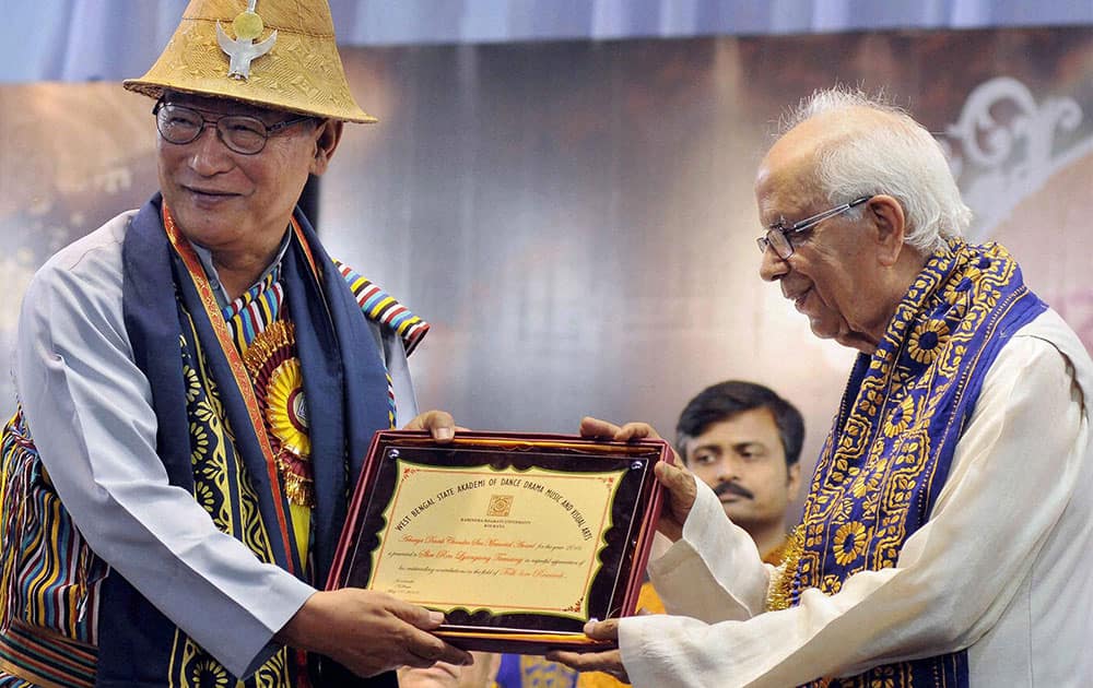 Pioneer of Lepcha language movement Ren Lyangsong Tamsang (L) being conferred with Acharya Dinesh Chandra Sen Memorial Award by West Bengal Governor Keshari Nath Tripathi, during the 41st Convocation of Rabindra Bharati Uniuversity in Kolkata.