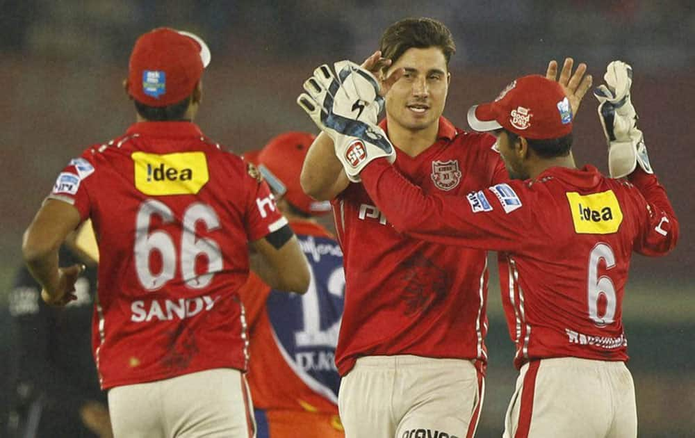  Marcus Stoinis of Kings XI Punjab celebrates the wicket of Quinton de Kock of Delhi Daredevils during am IPL 2016 match in Mohali.