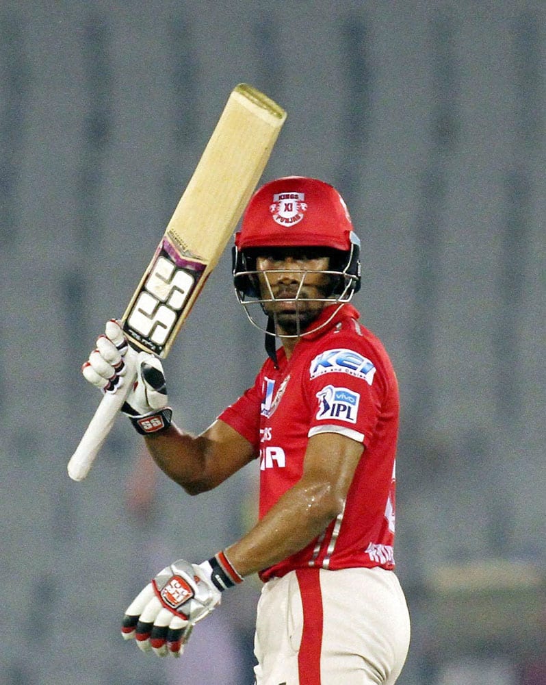 Kings XI Punjabs Wriddhiman Saha celebrates his half century during IPL match between the Kings XI Punjab and the Delhi Daredevils in Mohali.