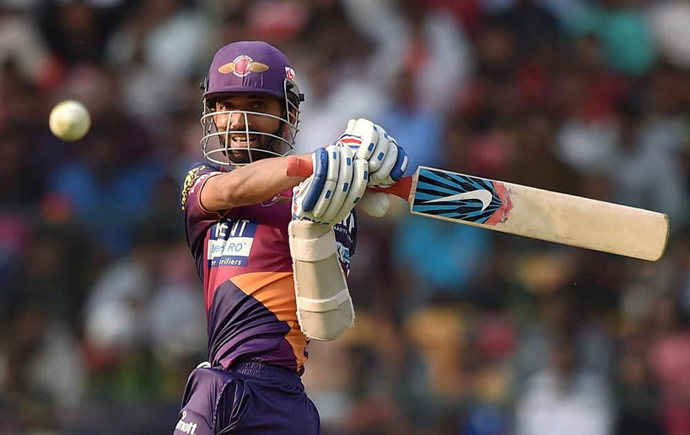 Rising Pune Supergiants Ajinkiya Rahane plays a shot during the IPL T20 match against Royal Challengers Bangalore in Bengaluru.