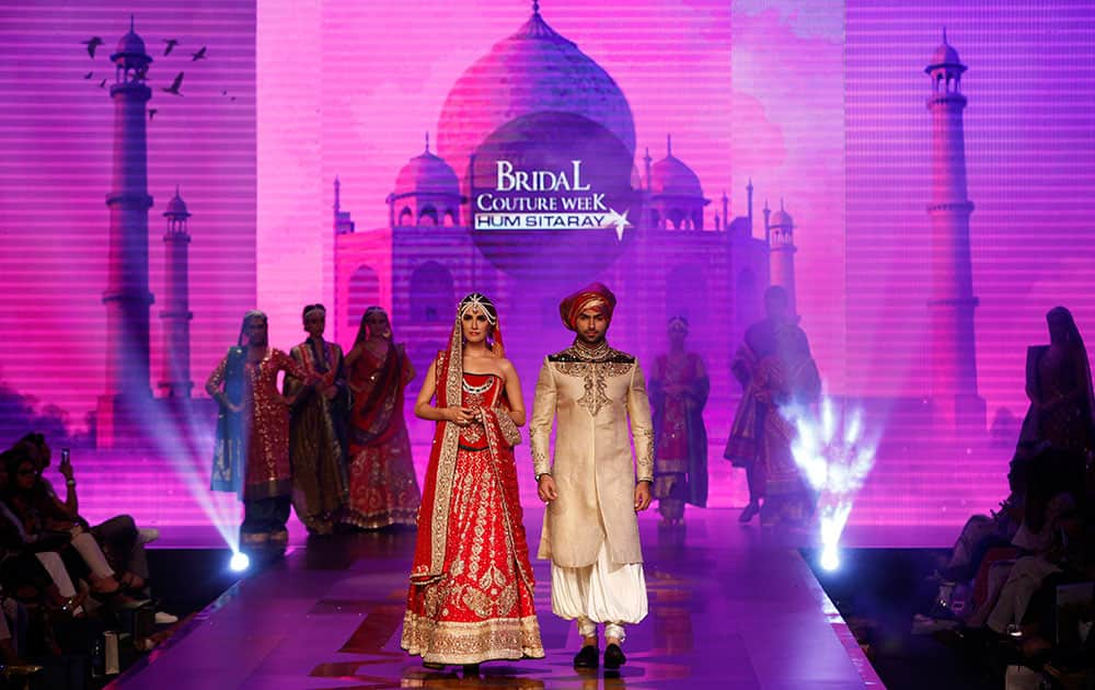 Models present creations by Pakistani designing label Kuki Concepts during Bridal Couture Week 2016 in Karachi, Pakistan.