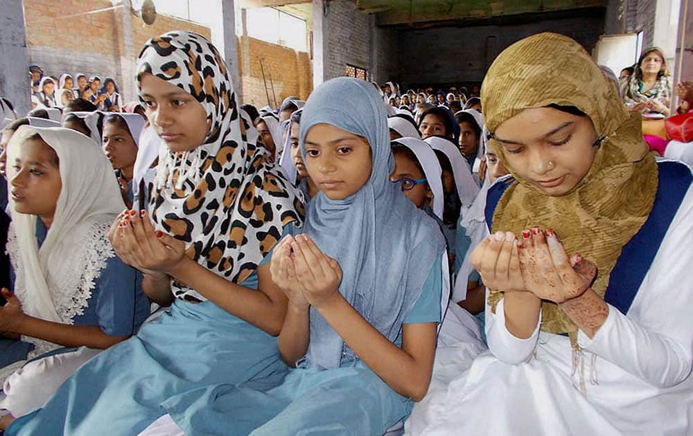 Muslim girls praying on the eve of Mothers Day at a Muslim college in Varanasi, Uttar Pradesh.