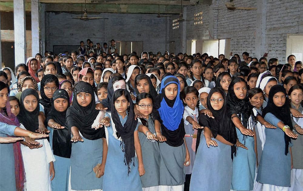 Muslim girls taking oath on the eve of Mothers Day at a Muslim college in Varanasi, Uttar Pradesh.