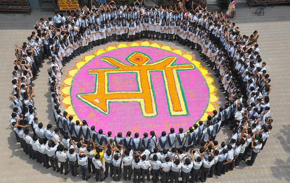 School children celebrate on the eve of Mothers Day in Moradabad.