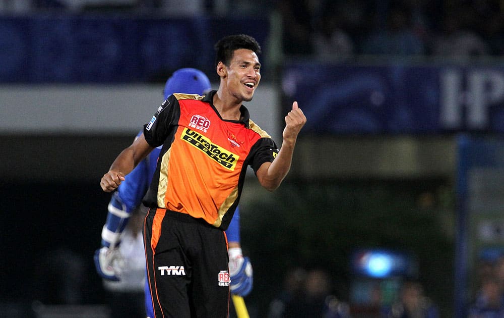 Sunrisers Hyderabad player Mustafizur Rahman celebrates the wicket of Mumbai Indians player Tim Southee during their IPL match in Visakhapatnam.