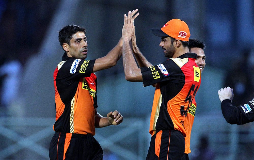 Sunrisers Hyderabad player Ashish Nehra celebrates the wicket of Mumbai Indians player Ambati Rayudu during their IPL match in Visakhapatnam.