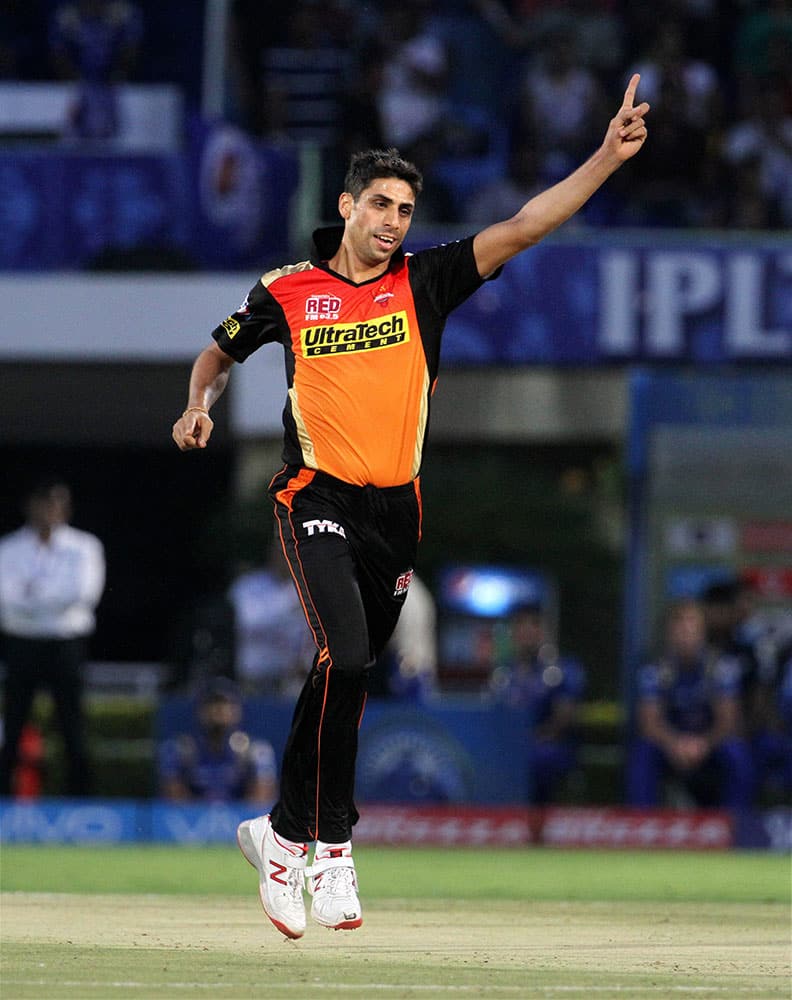 Sunrisers Hyderabad player Ashish Nehra celebrates the wicket of Mumbai Indians player Jos Buttler during their IPL match in Visakhapatnam.