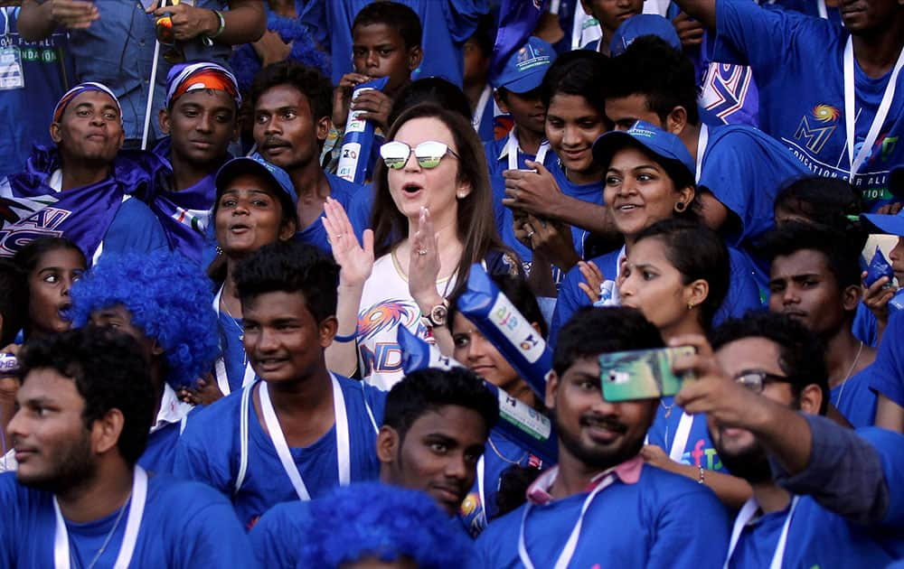 Mumbai Indians owner Nita Ambani with the Education For All underprivileged children who were the special invitees to watch IPL match between Mumbai Indians and Sunrisers Hyderabad in Visakhapatnam.