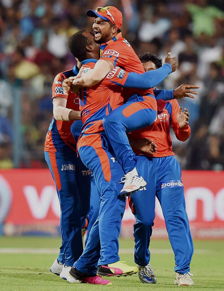 Gujarat Lions Captain Suresh Raina celebrate with team mates after the wicket of KKRs SA Yadav at Eden Garden in Kolkata.